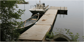 Wood docks blend in naturally with the lakeside environment.